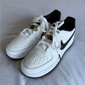 White and Black Sneakers with Gold Accents